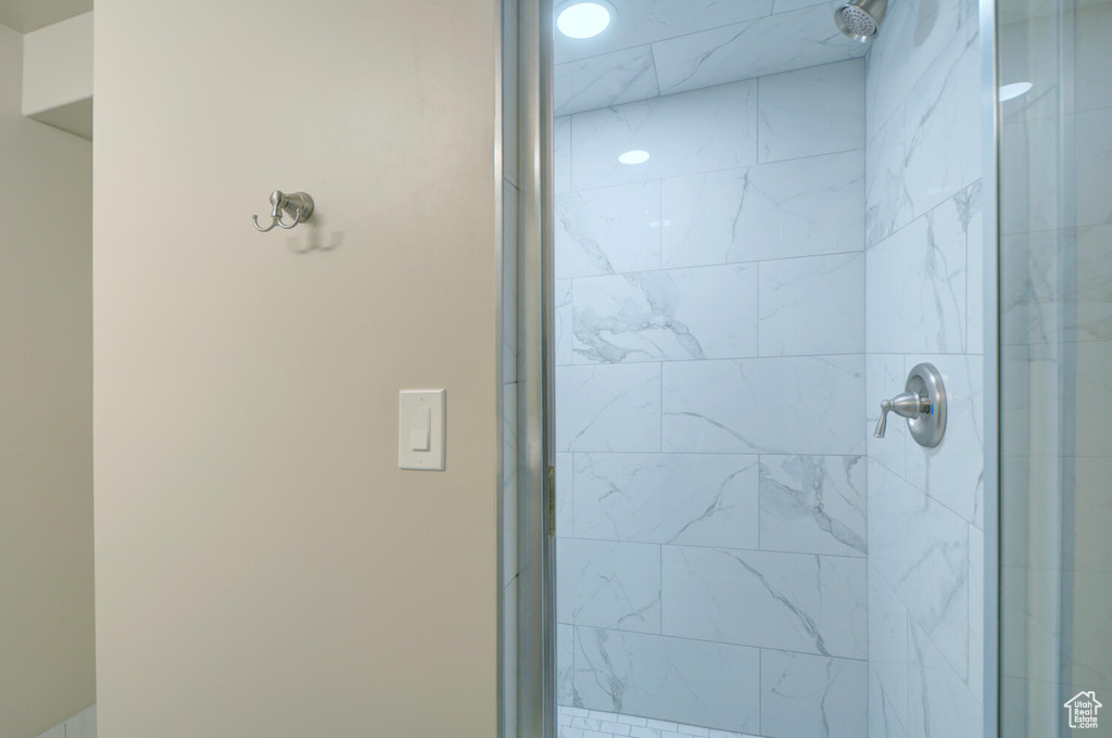 Bathroom with a shower with door