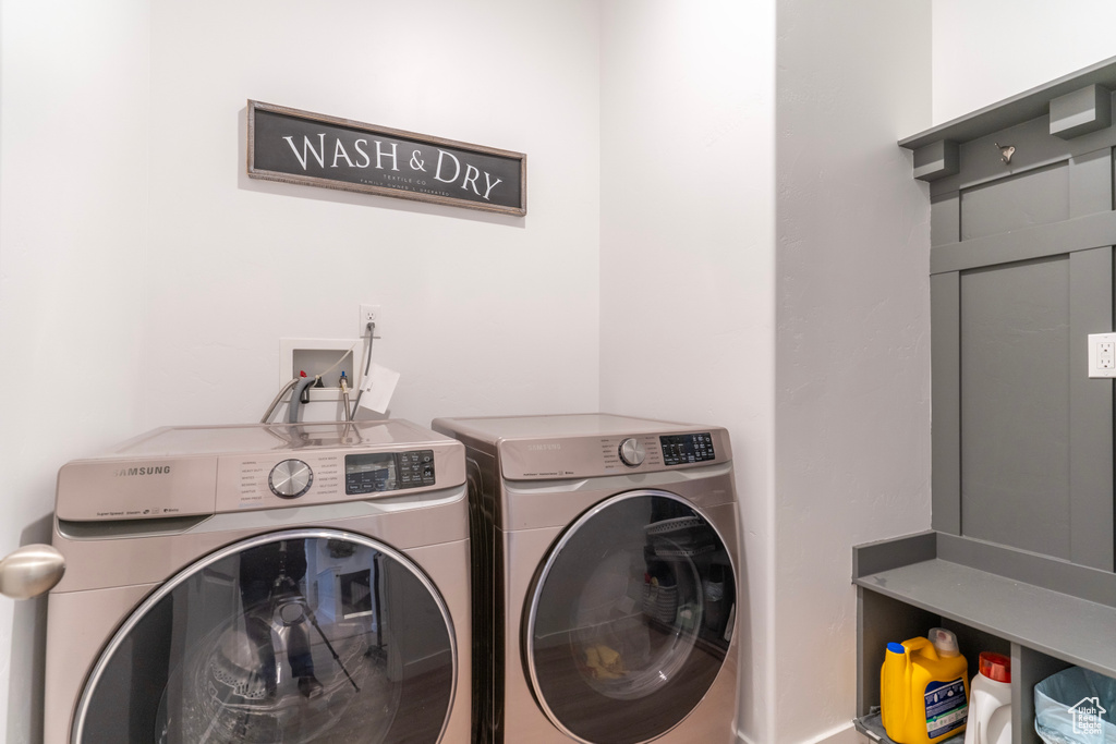 Clothes washing area with washer and dryer and washer hookup