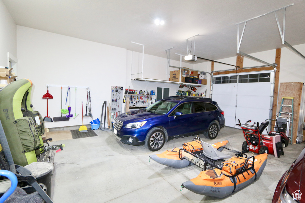 Garage featuring a garage door opener