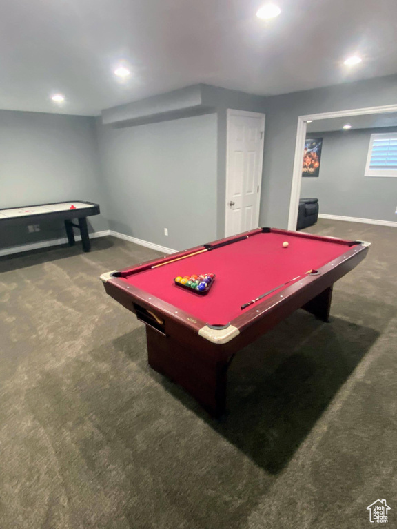 Game room featuring dark colored carpet and billiards