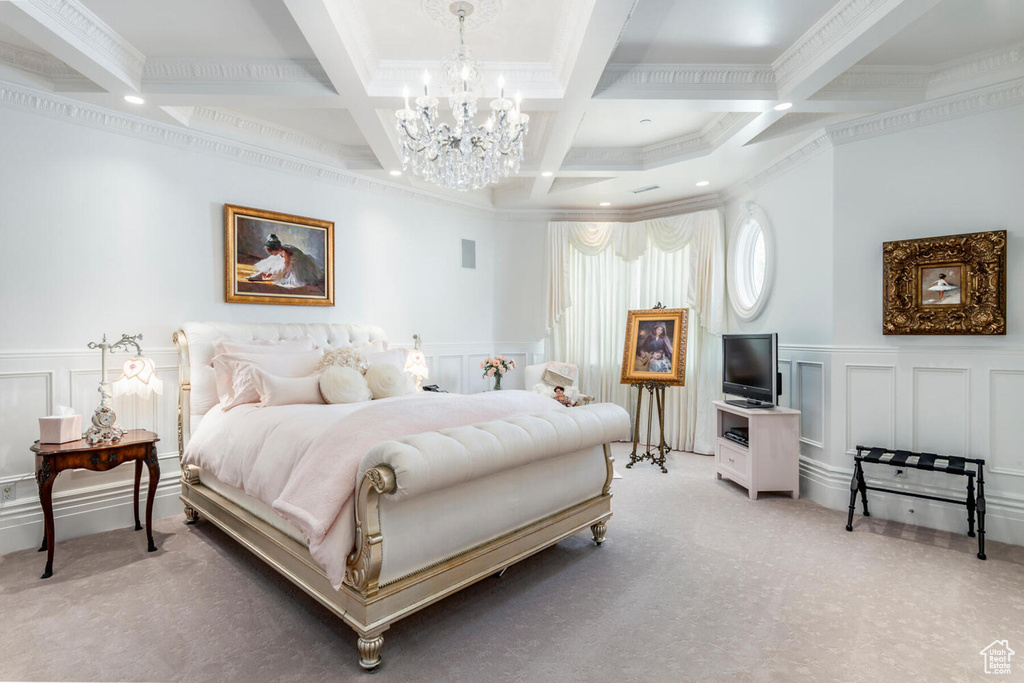 Bedroom featuring ornamental molding, coffered ceiling, a notable chandelier, and light colored carpet