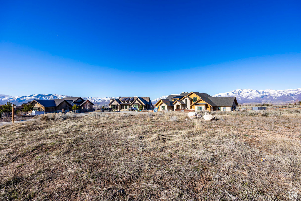 Property view of mountains with a rural view