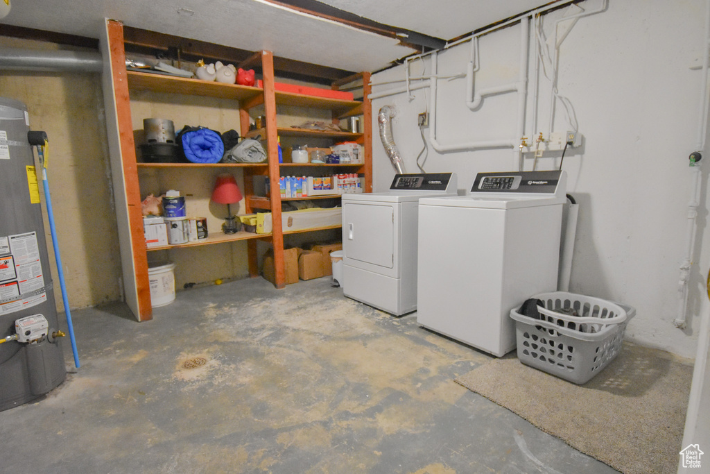 Interior space with water heater and washer and clothes dryer