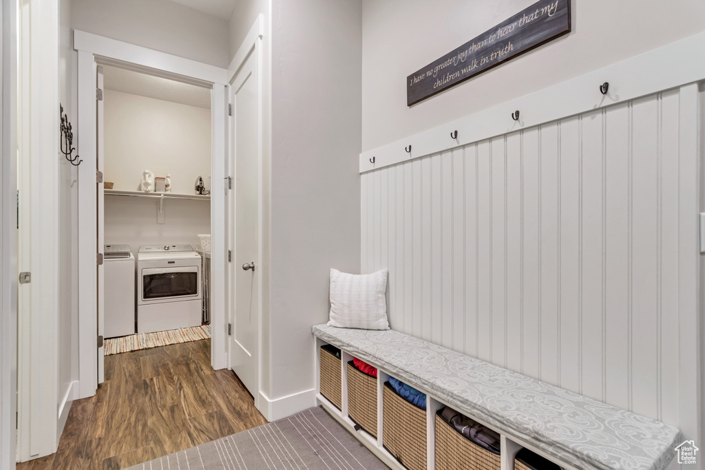 Mudroom featuring separate washer and dryer and dark hardwood / wood-style flooring
