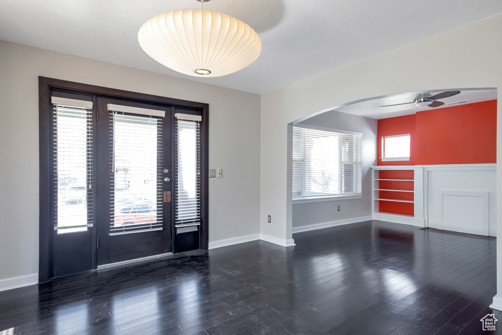 Foyer featuring plenty of natural light, dark hardwood / wood-style floors, and ceiling fan
