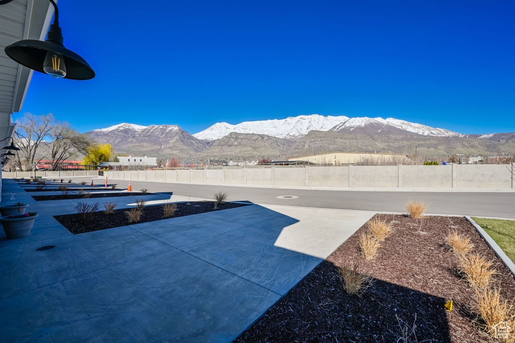 Exterior space with a patio and a mountain view