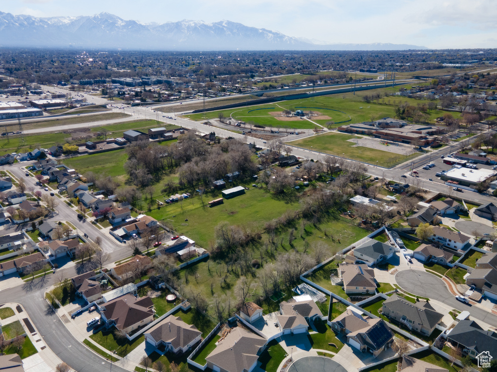 Birds eye view of property with a mountain view