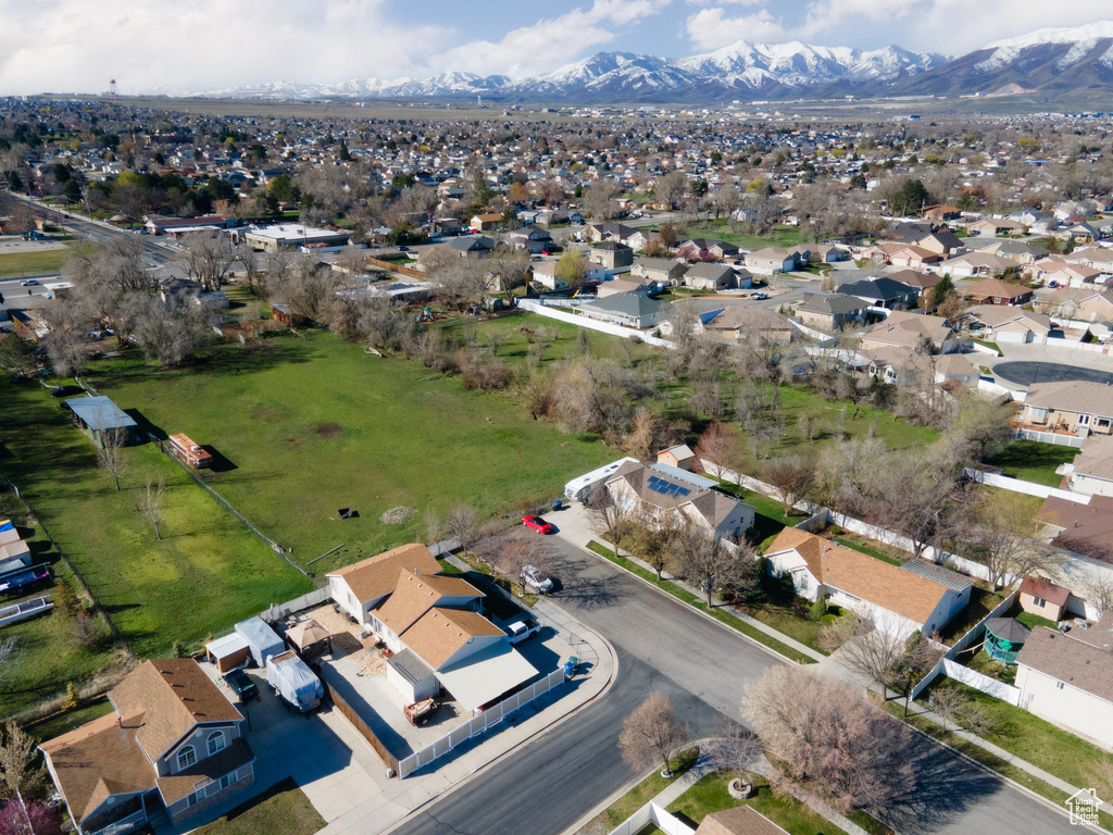 Birds eye view of property with a mountain view