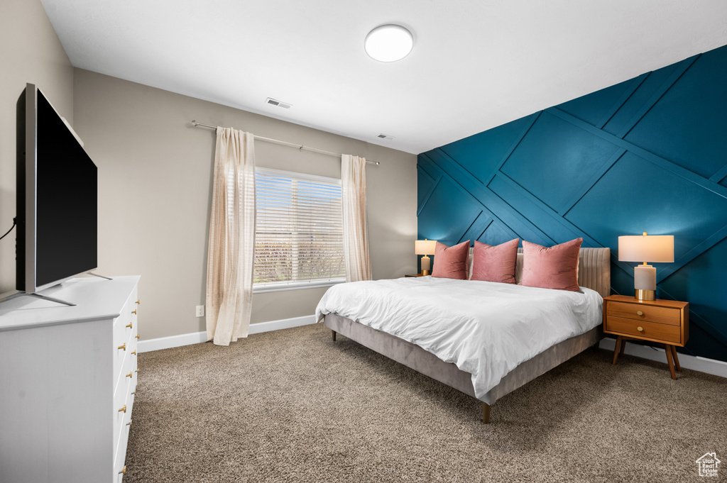 Bedroom featuring carpet floors