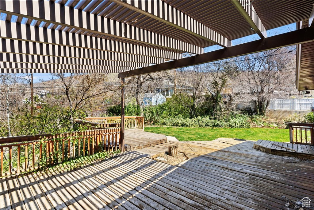 Wooden terrace featuring a pergola