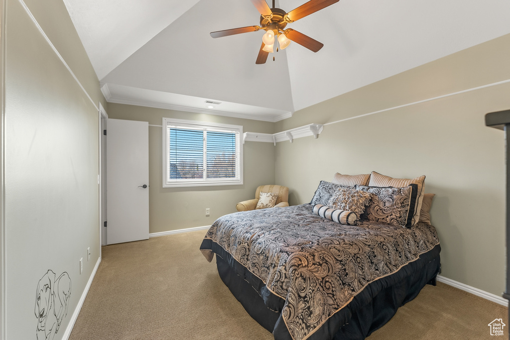 Bedroom with ceiling fan, light carpet, and high vaulted ceiling