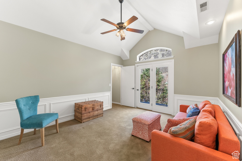 Living area featuring light carpet, high vaulted ceiling, beam ceiling, and ceiling fan