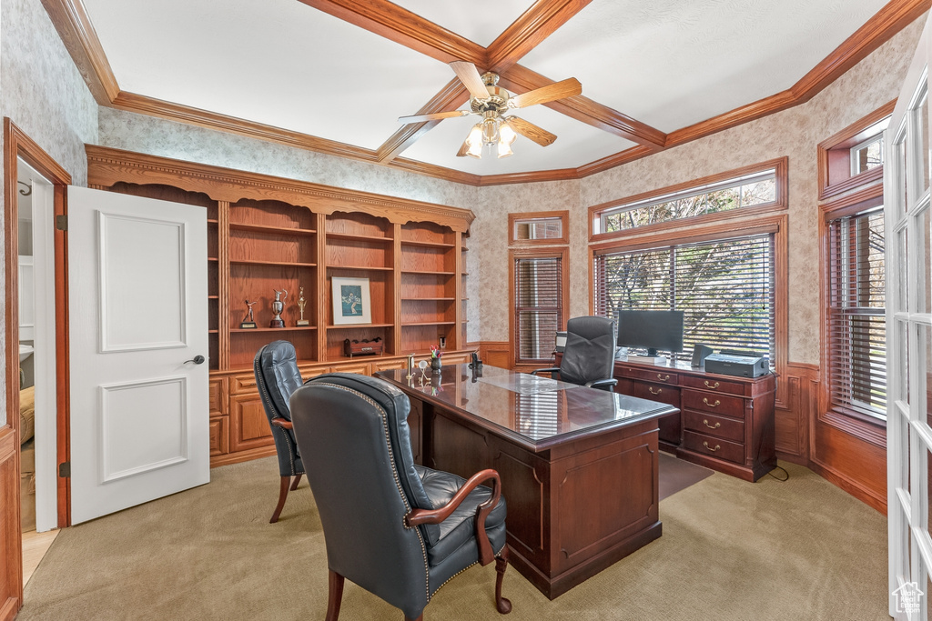 Carpeted office with ceiling fan, coffered ceiling, and ornamental molding