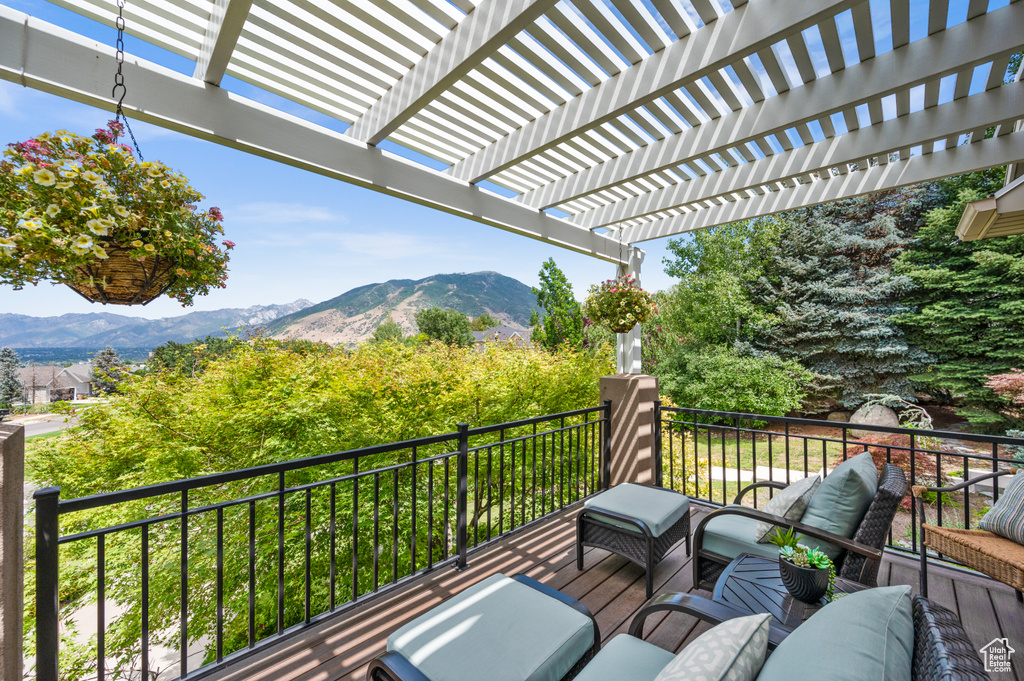 Exterior space featuring a pergola, a mountain view, and an outdoor hangout area