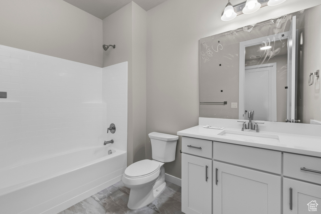 Full bathroom featuring shower / washtub combination, toilet, tile flooring, and oversized vanity