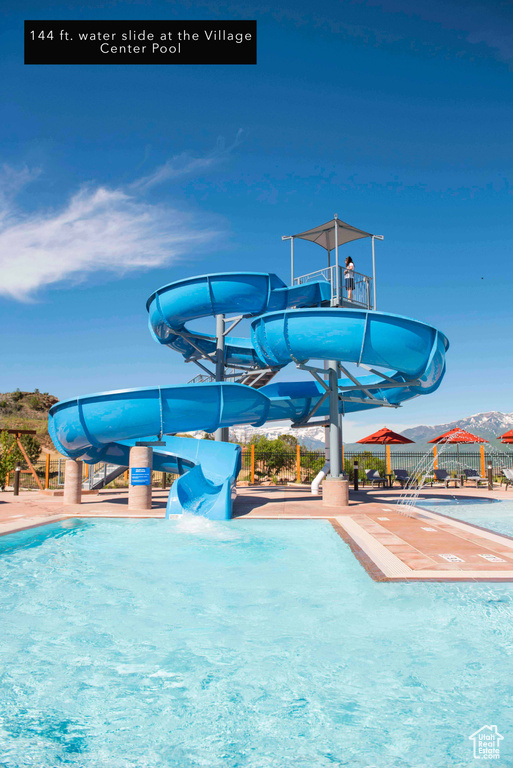 View of pool with a water slide