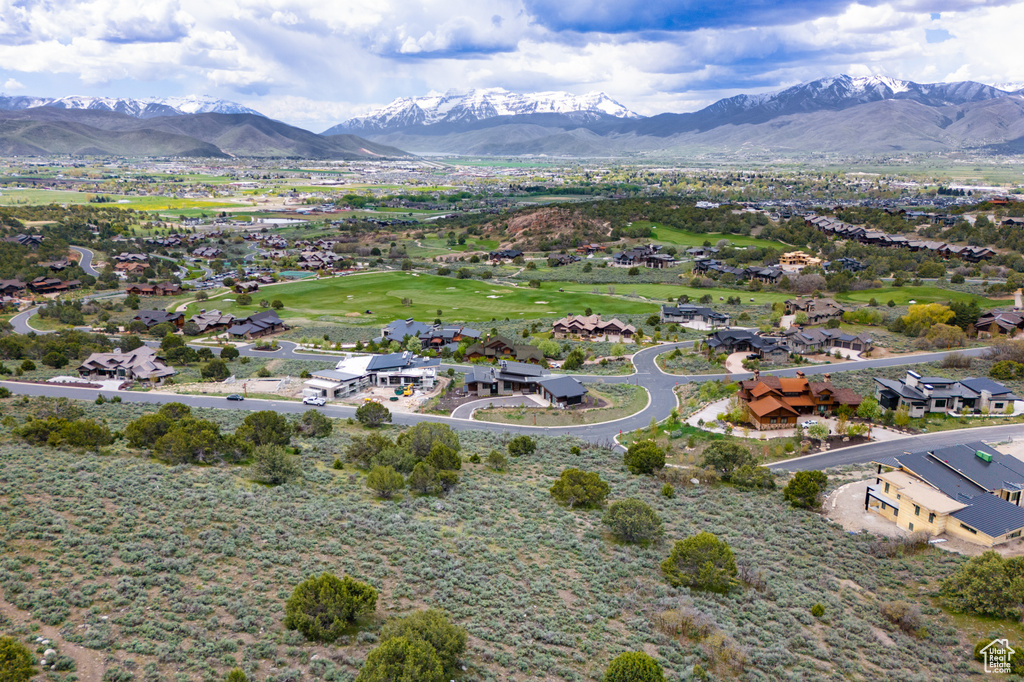 Birds eye view of property with a mountain view