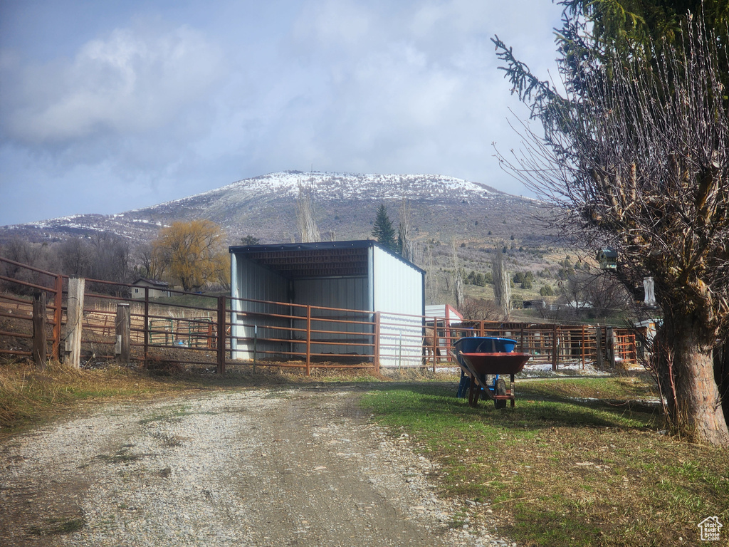 View of stable featuring a mountain view