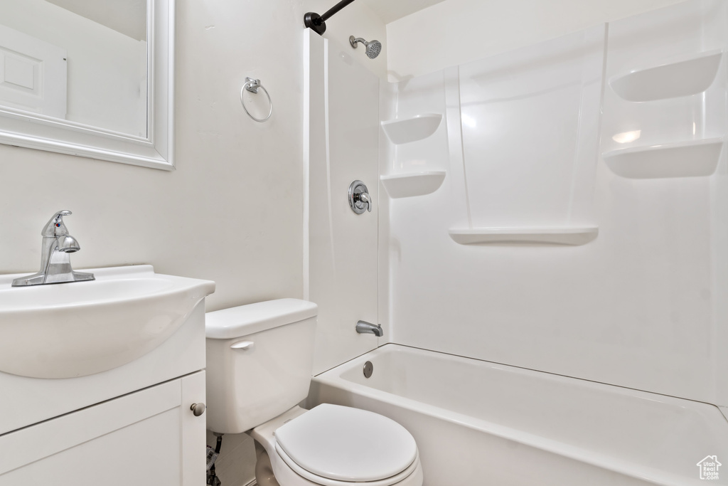 Full bathroom with toilet, shower / bathtub combination, and vanity