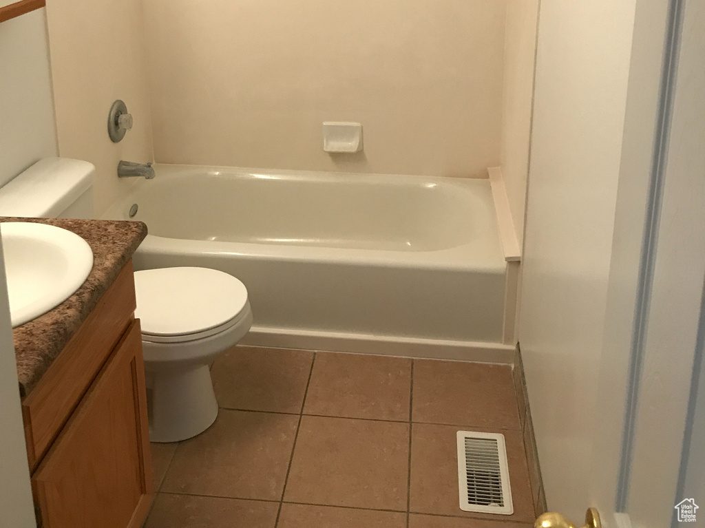 Full bathroom with vanity, tile flooring, bathtub / shower combination, and toilet