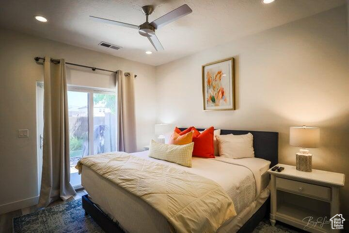 Bedroom featuring access to exterior and ceiling fan