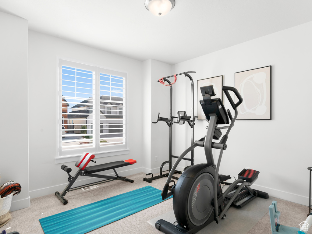 Workout room with light carpet