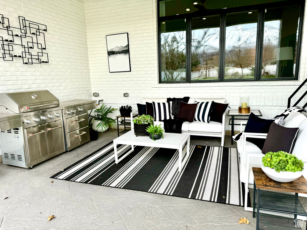 Exterior space featuring an outdoor hangout area and area for grilling