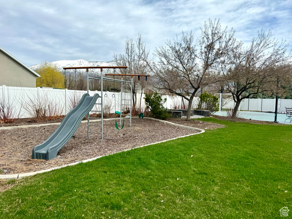 View of jungle gym featuring a yard