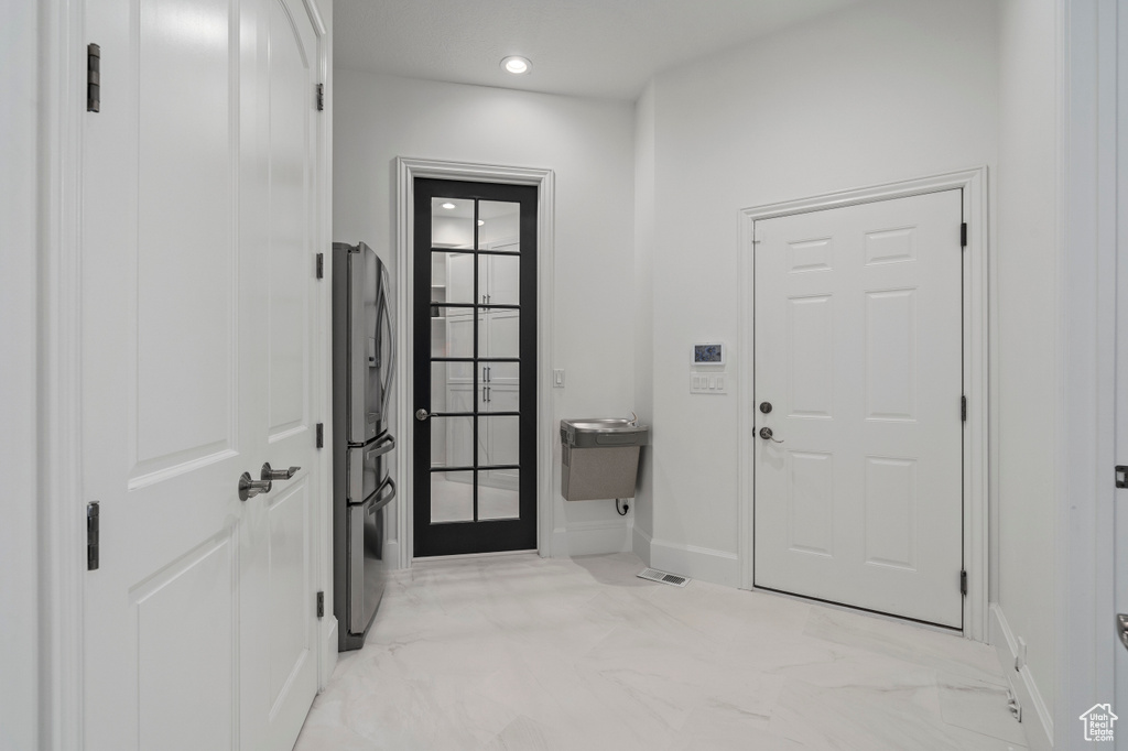Entryway featuring light tile floors