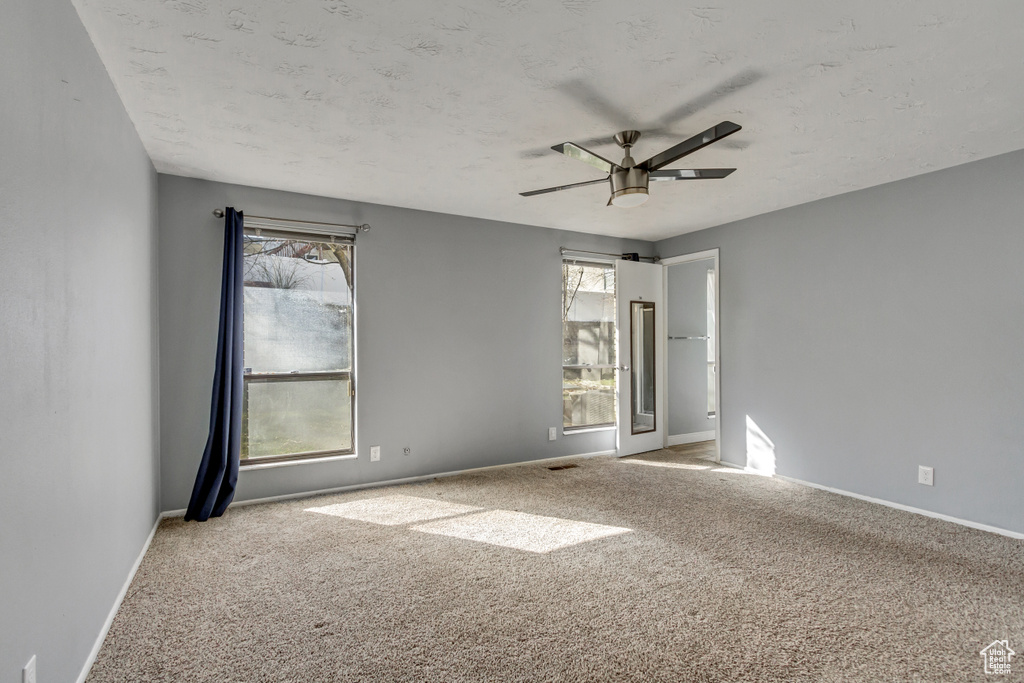 Unfurnished room with carpet flooring and ceiling fan