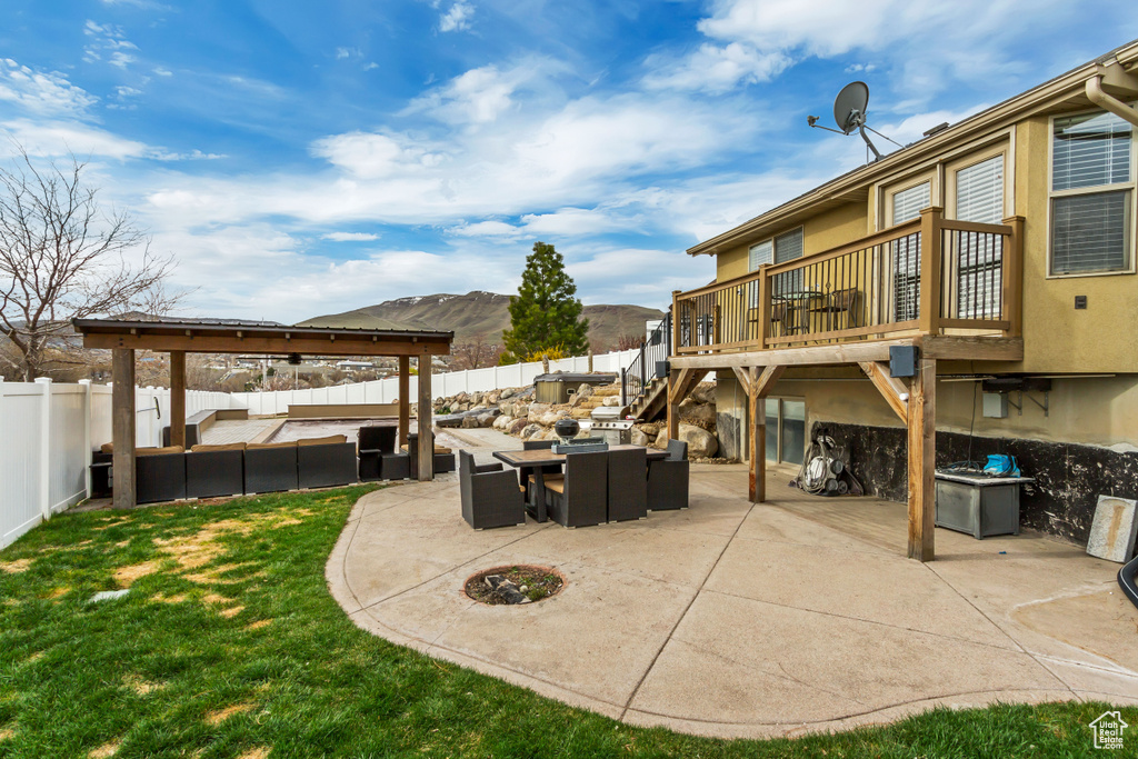 View of patio featuring a deck with mountain view and outdoor lounge area