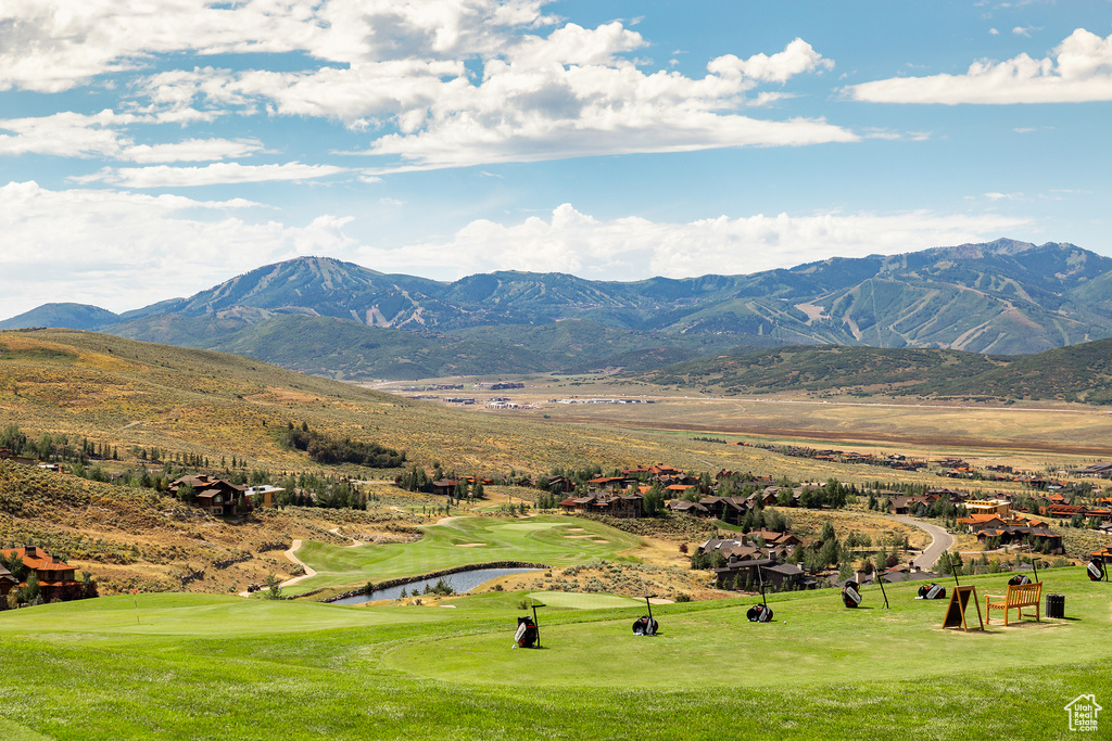 Property view of mountains featuring a water view