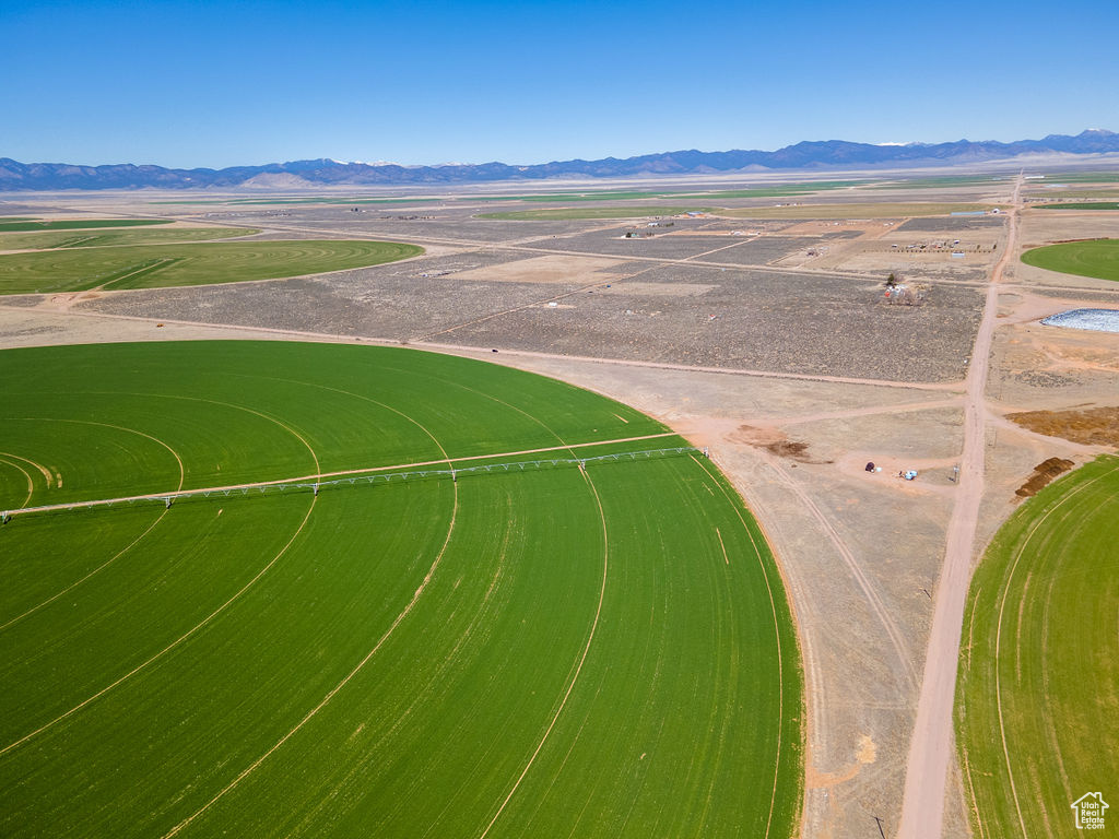 Birds eye view of property with a rural view and a mountain view