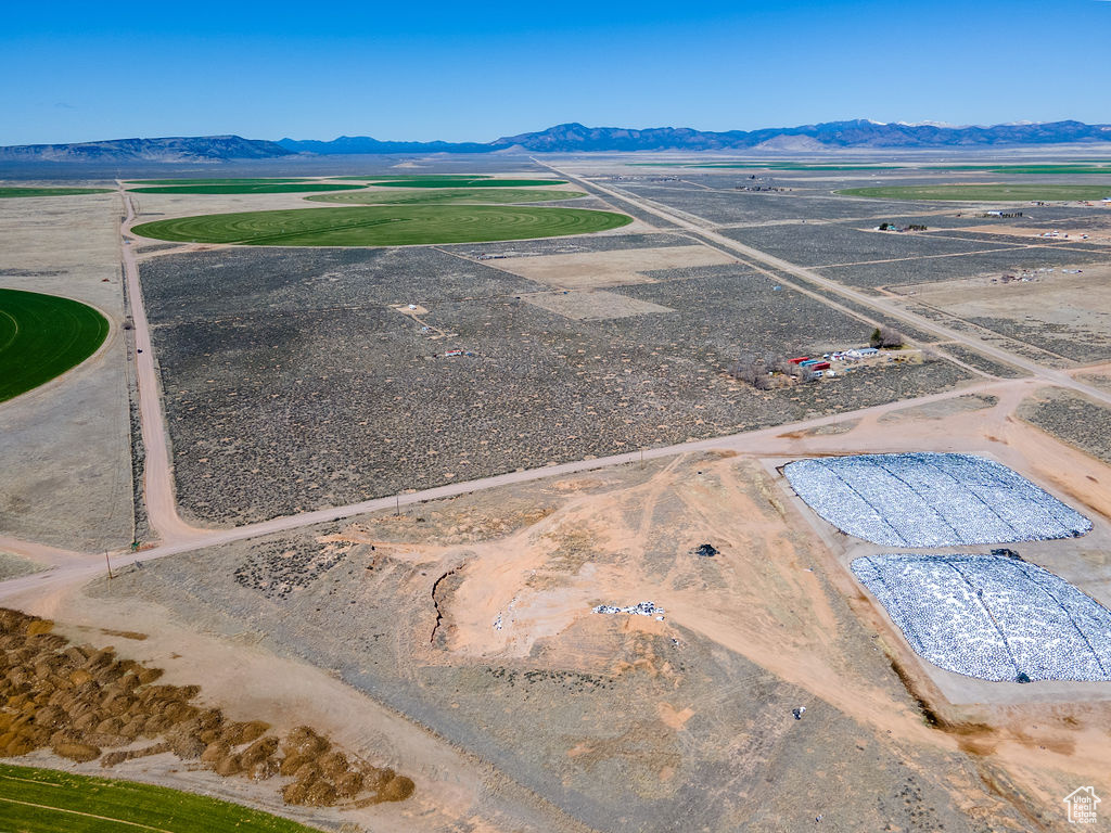 Birds eye view of property with a mountain view and a rural view