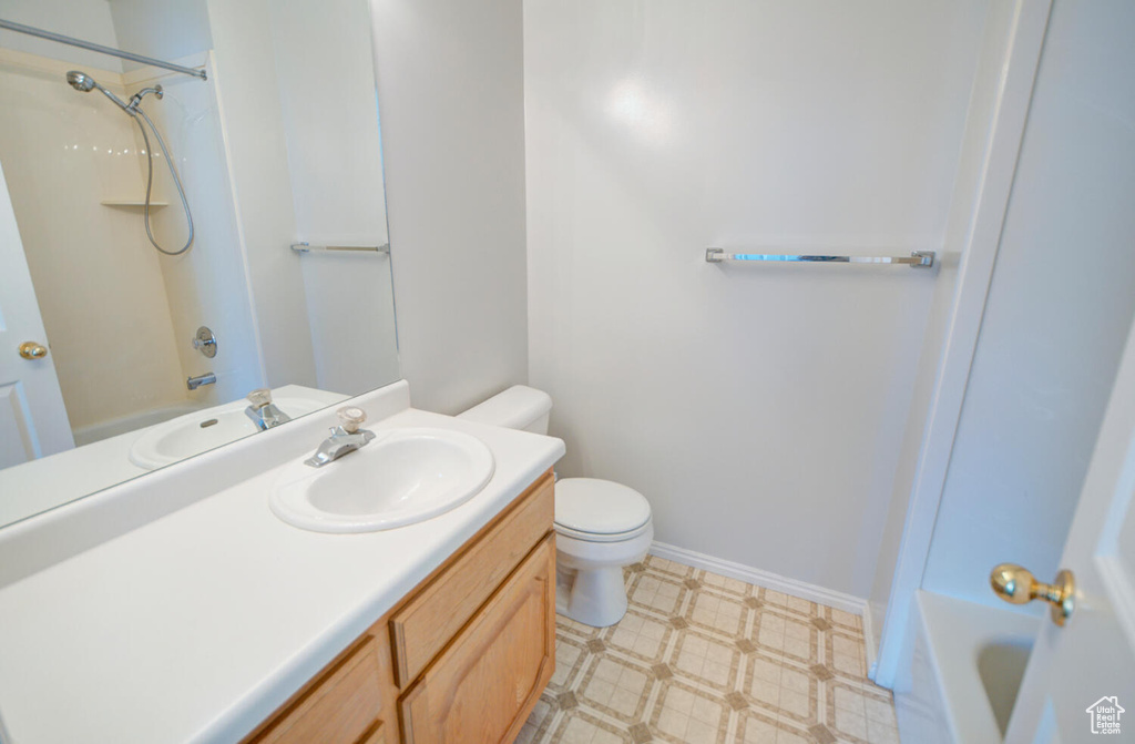 Full bathroom featuring oversized vanity,  shower combination, toilet, and tile floors