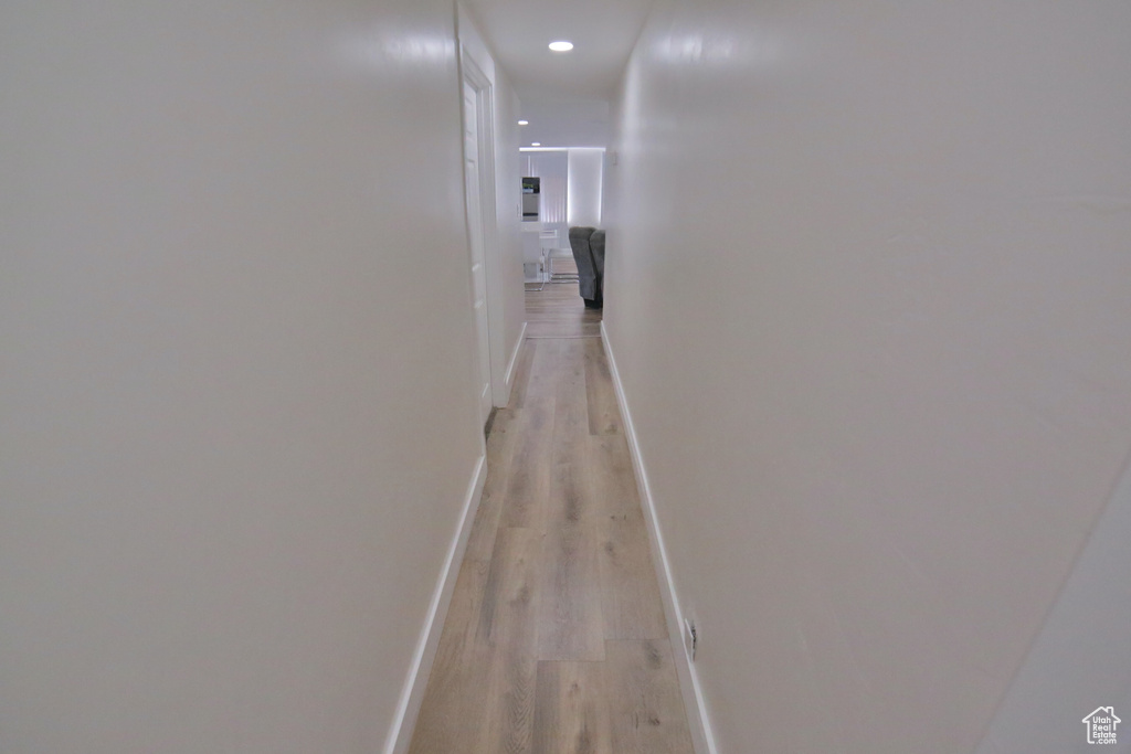 Hallway with light wood-type flooring