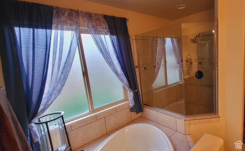 Bathroom featuring plus walk in shower and toilet
