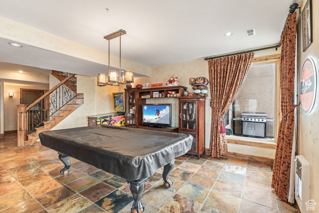 Game room with billiards and tile floors