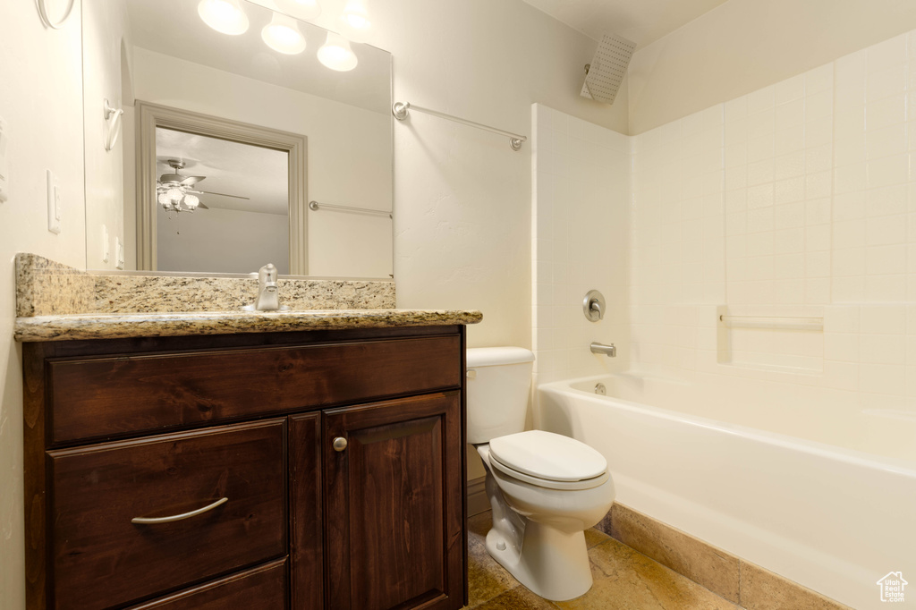 Full bathroom with toilet, shower / bathing tub combination, ceiling fan, vanity, and tile flooring
