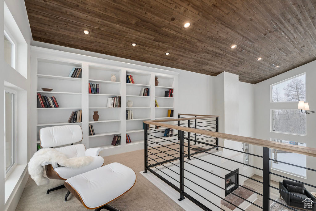 Hall featuring wooden ceiling and built in shelves
