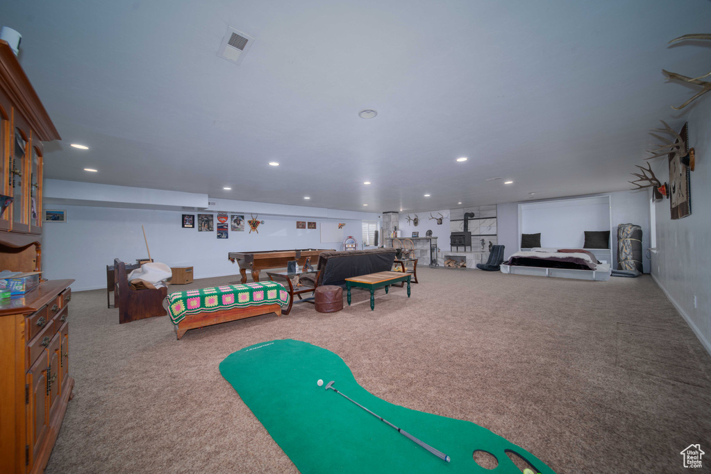 Interior space with light colored carpet and pool table