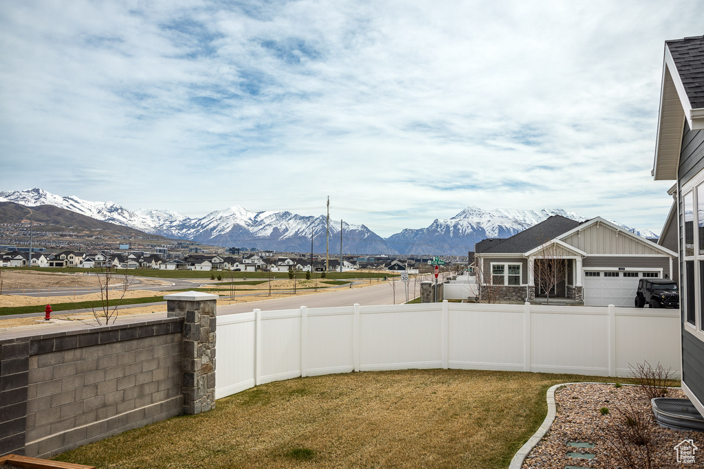 View of yard featuring a garage and a mountain view