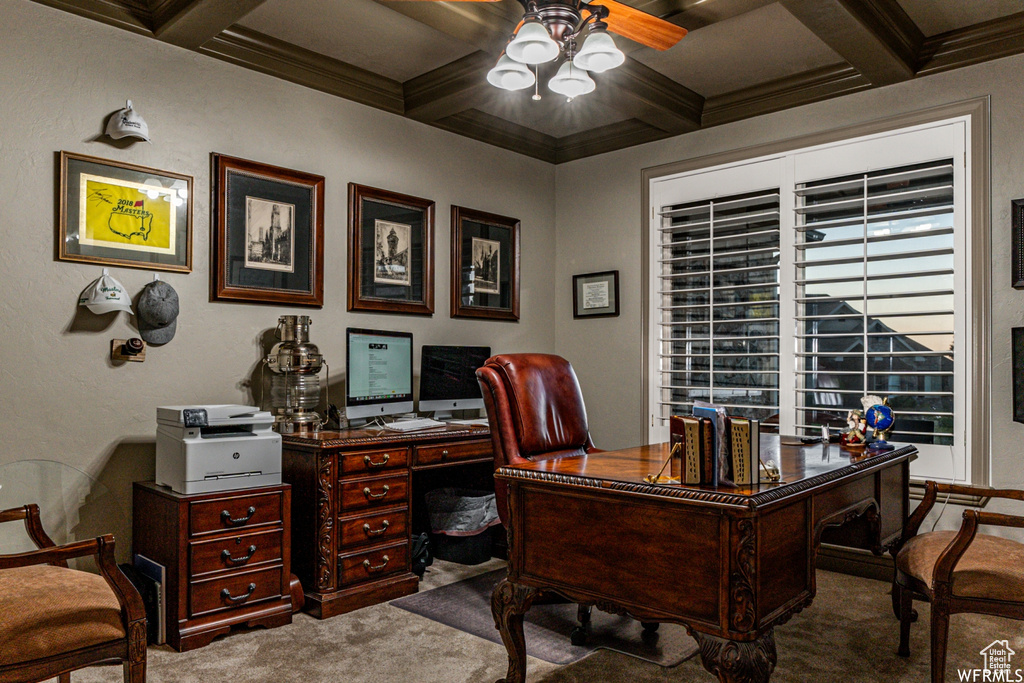 Office featuring coffered ceiling, dark carpet, ceiling fan, and beamed ceiling