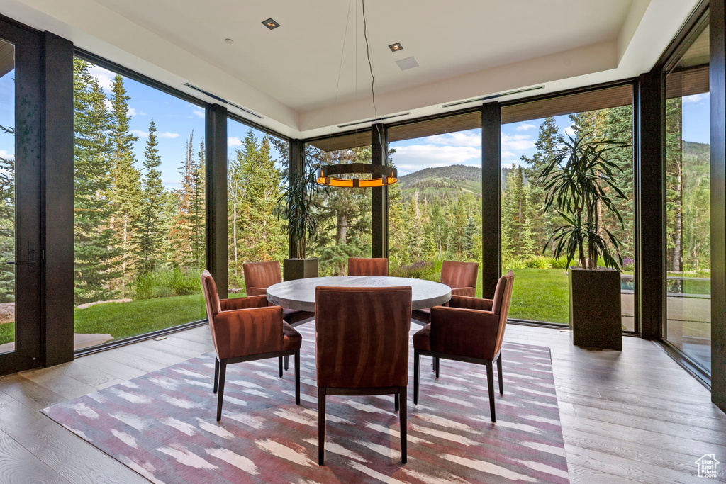 Sunroom with a mountain view