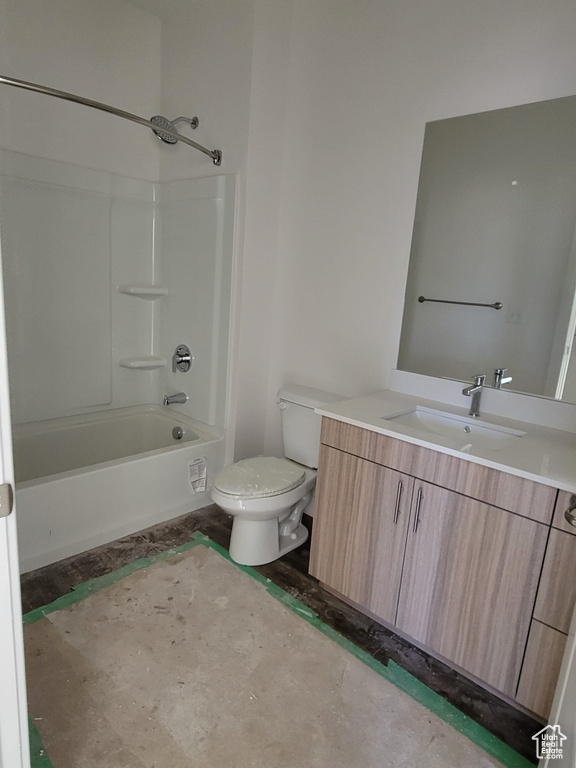 Full bathroom with bathing tub / shower combination, toilet, concrete floors, and vanity