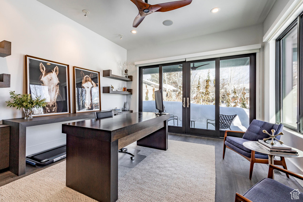 Office space with hardwood / wood-style floors, ceiling fan, and french doors