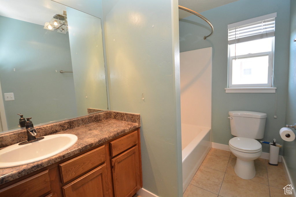 Full bathroom with toilet, tile flooring, shower / bathtub combination, and vanity with extensive cabinet space
