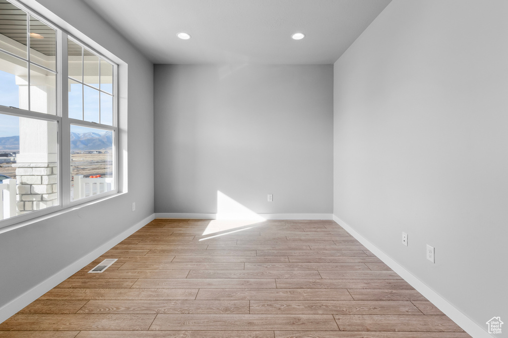 Spare room with light hardwood / wood-style flooring