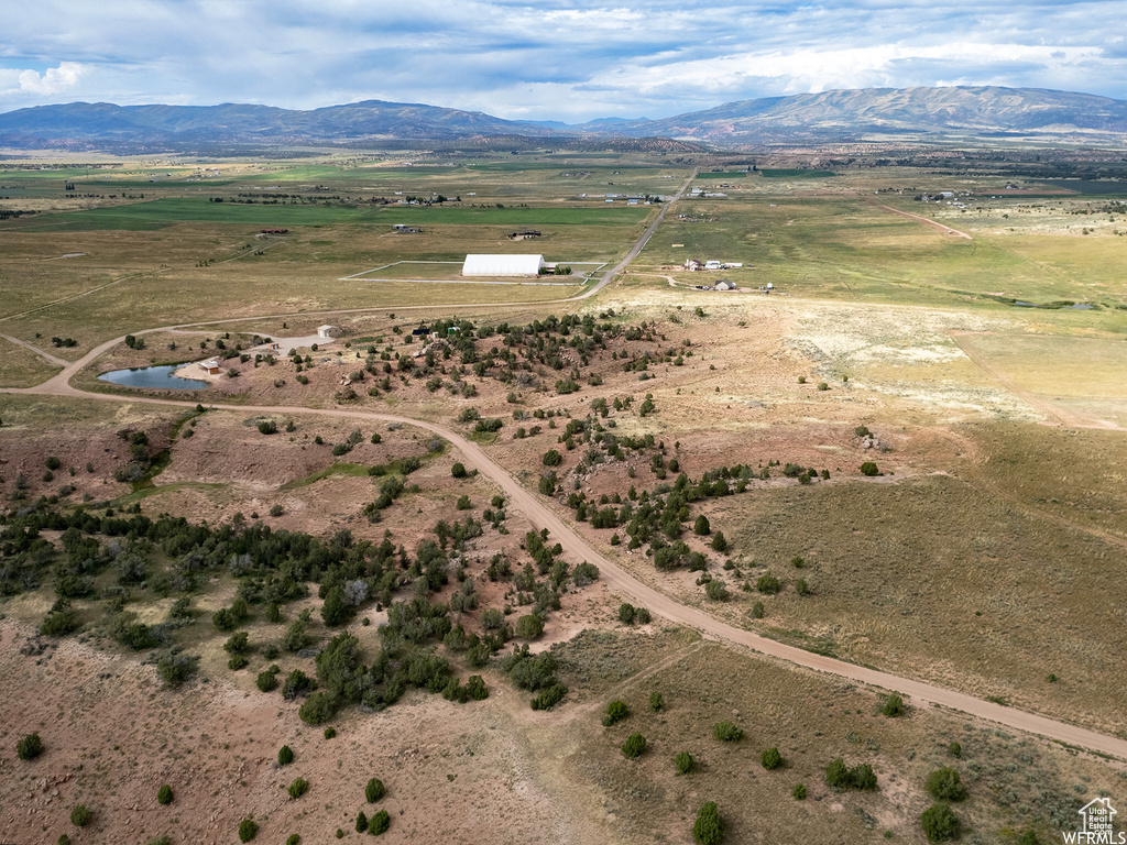 Birds eye view of property featuring a mountain view and a rural view