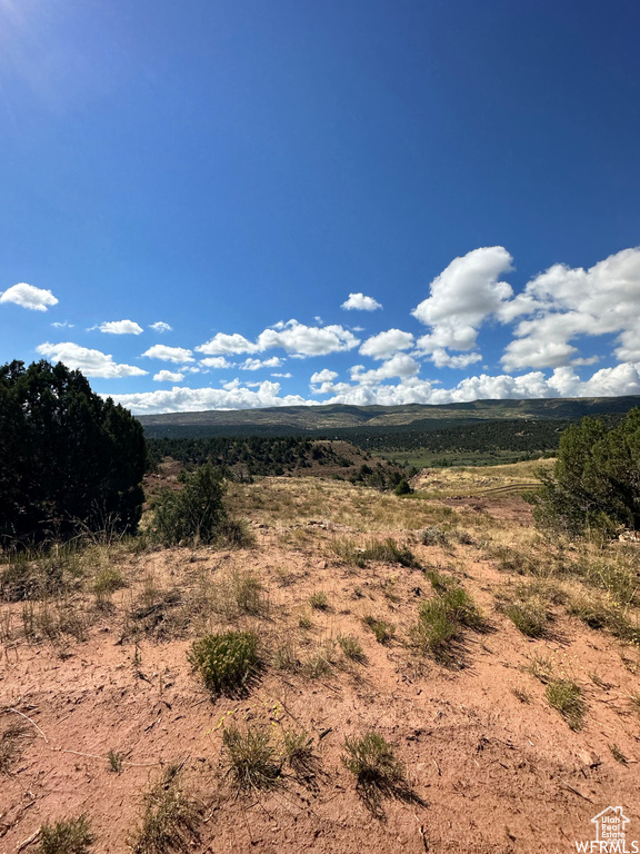 Property view of mountains with a rural view